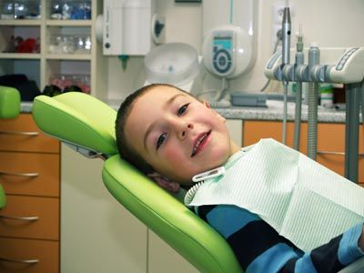 young patient smiling while in the dental chair at Smile Team Pediatric Dentistry