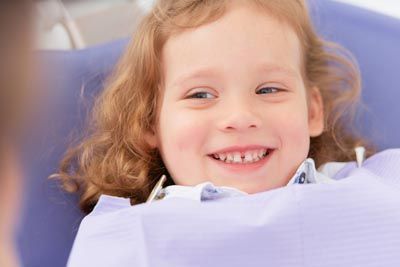 young girl smiling during her dental visit at Smile Team Pediatric Dentistry